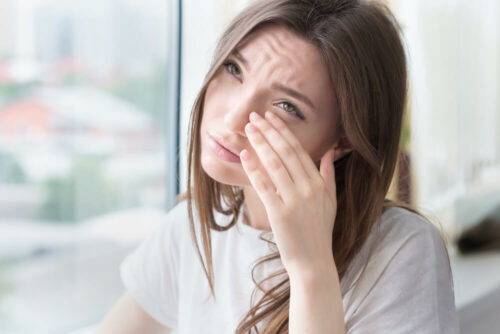 young woman with sore eyes