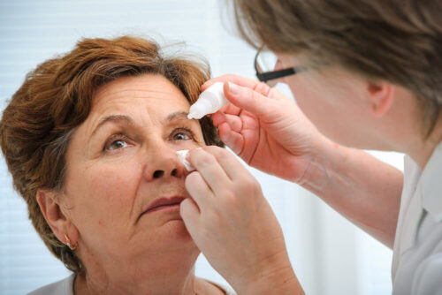 Woman getting eye drops