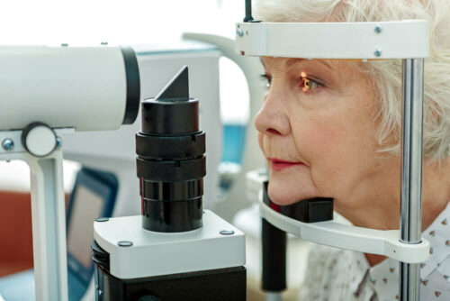 older woman getting eye exam