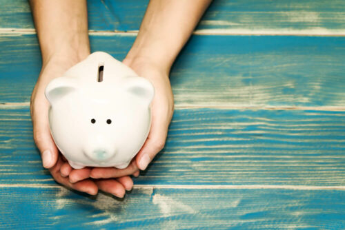White piggy bank with blue background