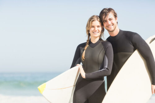Couple in their early 40s surfing