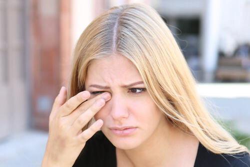 Woman suffering from eye pain