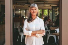 woman standing outside of a restaurant