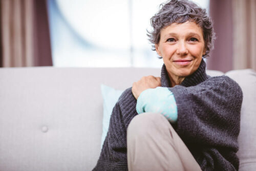 Older woman sitting on couch