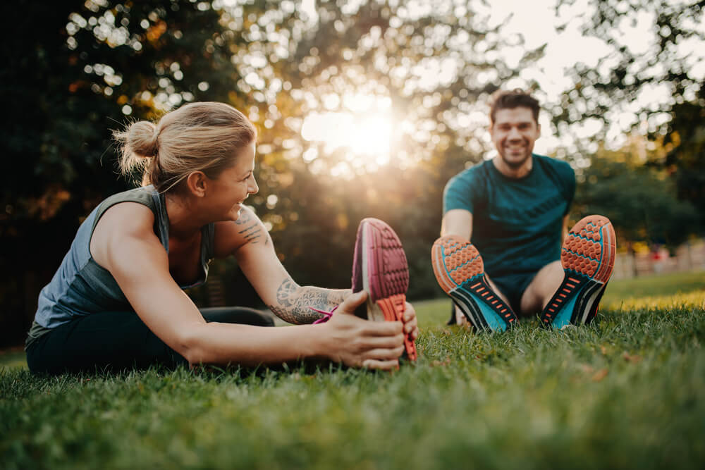 Man and woman stretching