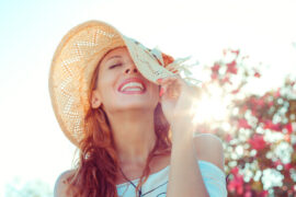 woman smiling with hat on